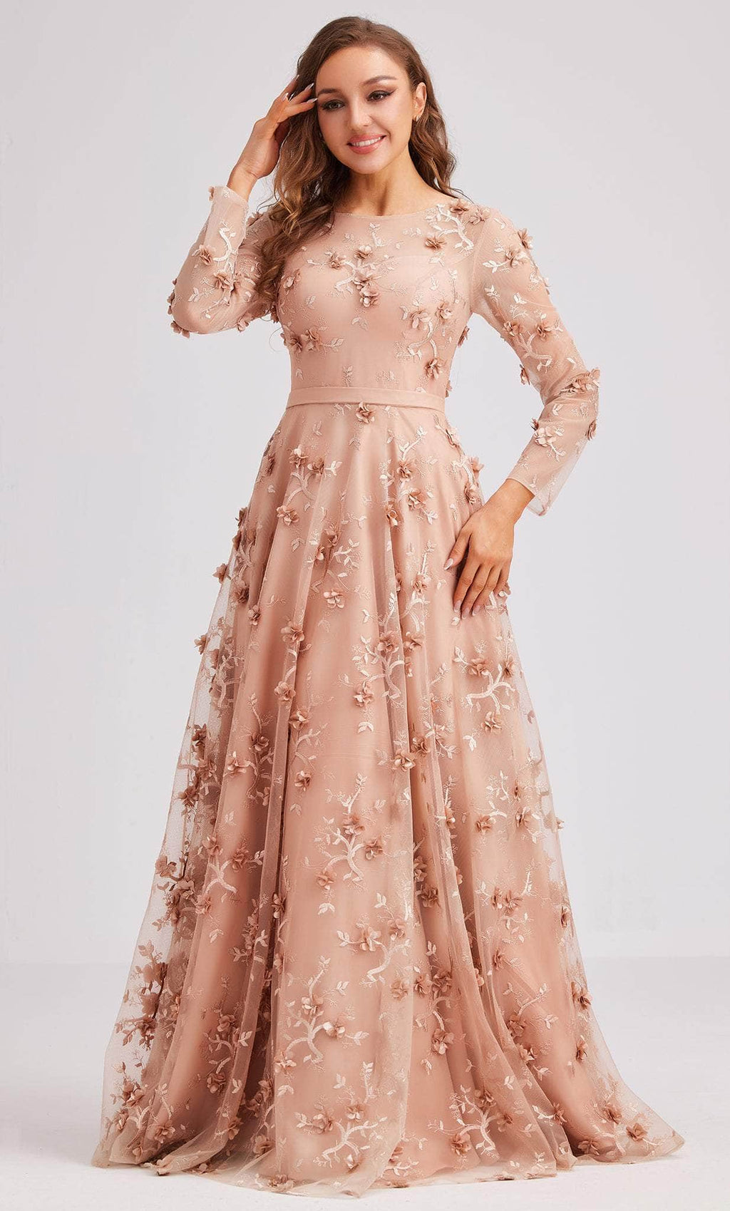 This beautiful gown features long mesh sleeves, a fitted waist and with floral applique.